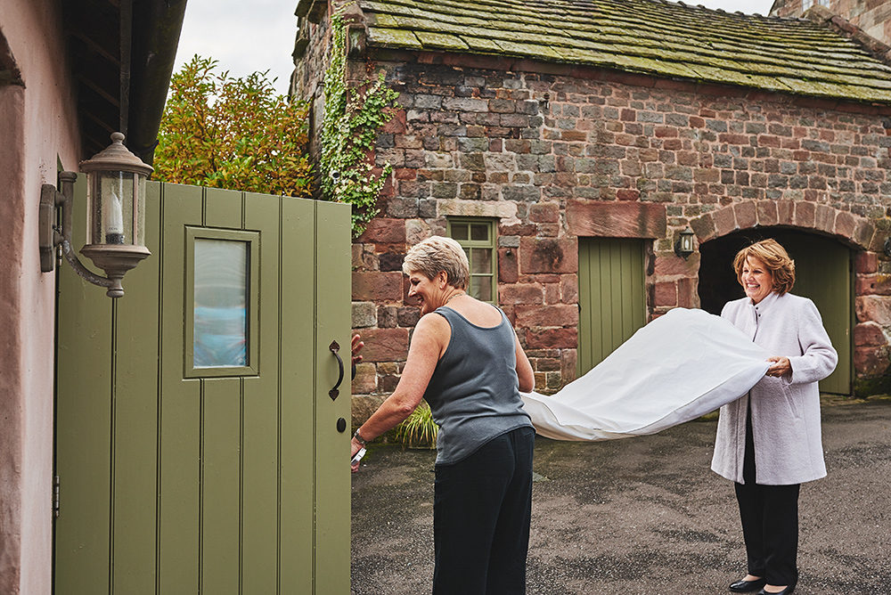 The mums carrying the brides dress at The Ashes in Staffordshire