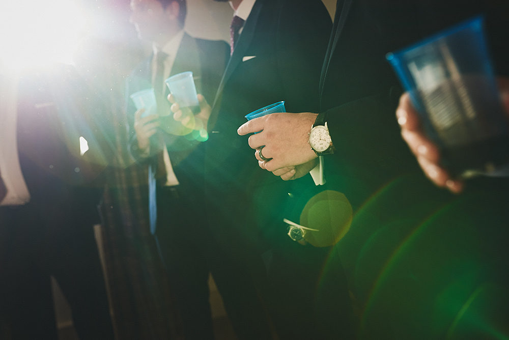 The groomsman drinking port before the wedding ceremony