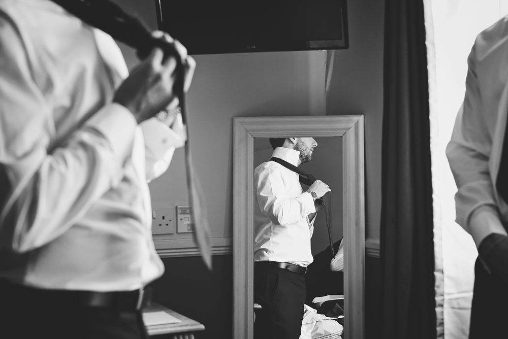 Groomsman getting ready - Sandhole Oak Barn Wedding