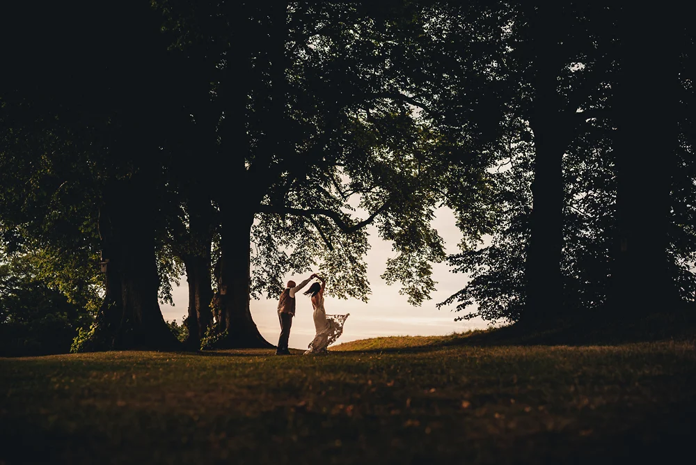 Shrigley Hall Macclesfield Wedding Photographer - Groom and bride dancing in woodland