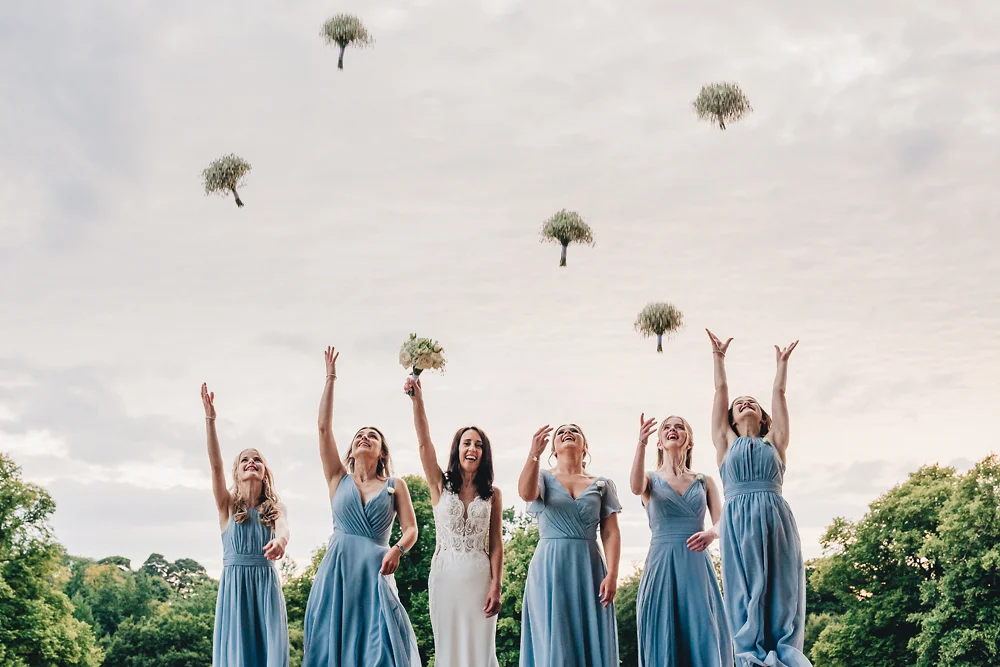Shrigley Hall Macclesfield Wedding Photographer - Bridal party throwing bouquets