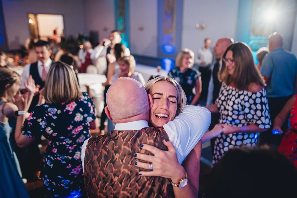 Shrigley Hall Macclesfield Wedding Photographer - Congratulations hug