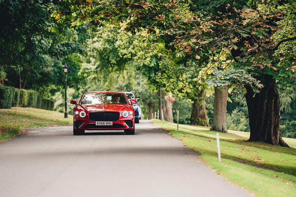 Shrigley Hall Macclesfield Wedding Photographer - Groomsman arrive in Bentley's