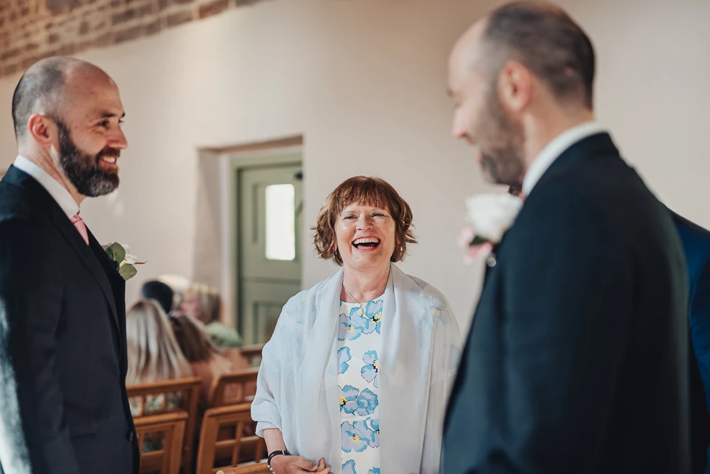 Guests enjoying themselves before the wedding at The Ashes Barns in Staffordshire