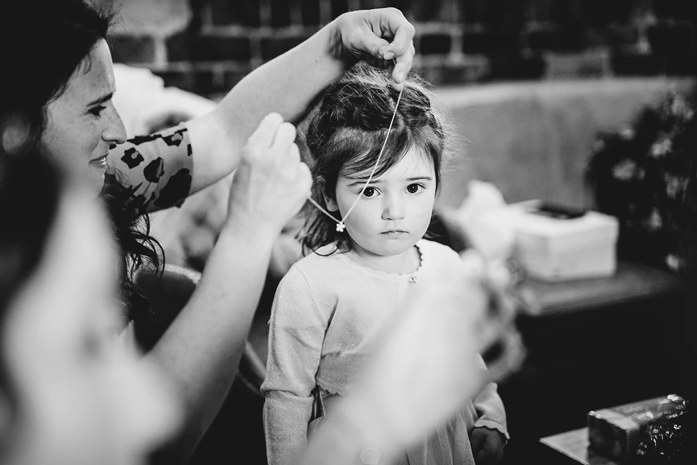 Flower girl getting ready at The Ashes Barns in Staffordshire