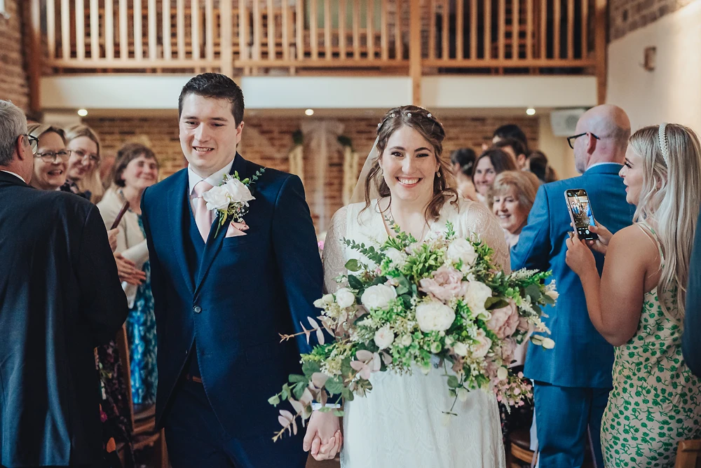 Bride & groom walk out after the ceremony at The Ashes Barns Staffordshire