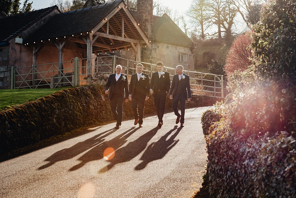 The groomsman take a walk at The Ashes barns in Staffordshire