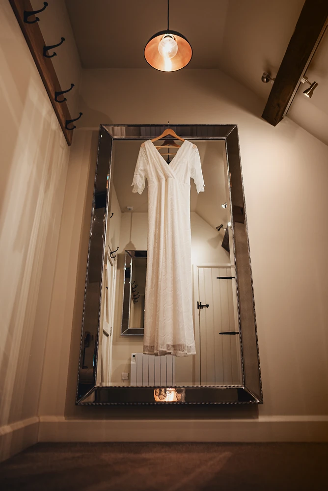 Brides dress hanging at The Ashes Barns in Staffordshire